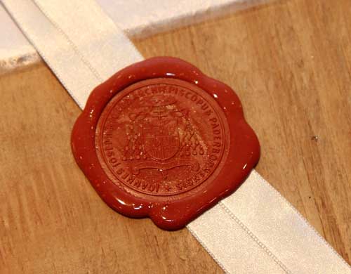 The Archbishop's seal was affixed to the box containing the results of the Diocesan Informative Process.